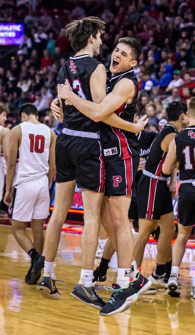 Pewaukee's Nick Leffler, left, and Nick Janowski celebrate the team's second consecutive WIAA Division 2 boys basketball state championship after defeating La Crosse Central, 67-48, at the Kohl Center in Madison on Saturday, March 19, 2022.